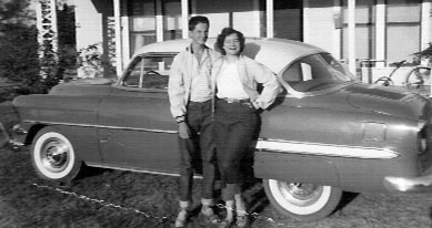 Gene and Sue Lantz with the neighbor's new car, 1954